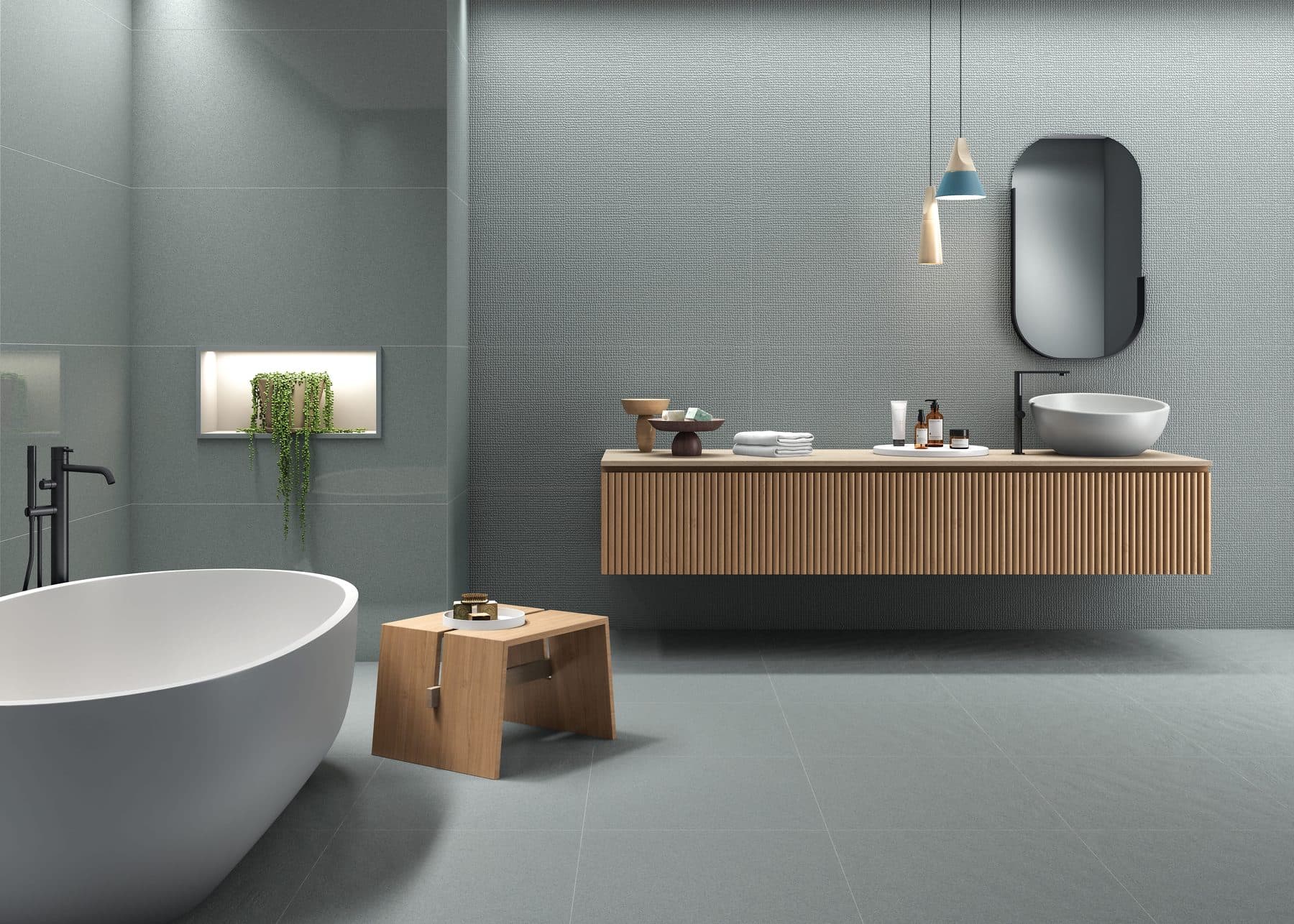 Simpolo tiled bathroom with freestanding bathtub and floating vanity